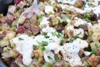 Skillet Philly Cheesesteak Hash with Peppers and Onions