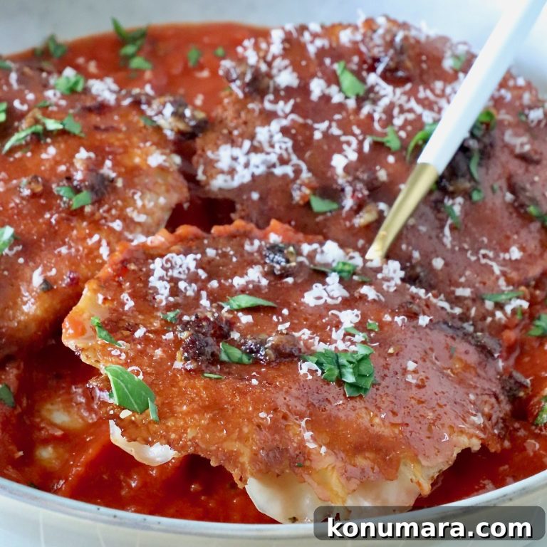 Baked Chicken Parmesan Ravioli with Crispy Mozzarella Crust