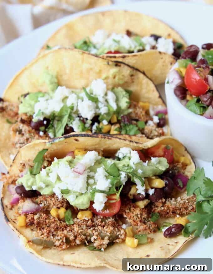 Tacos on plate filled with crispy cactus strips and salsa