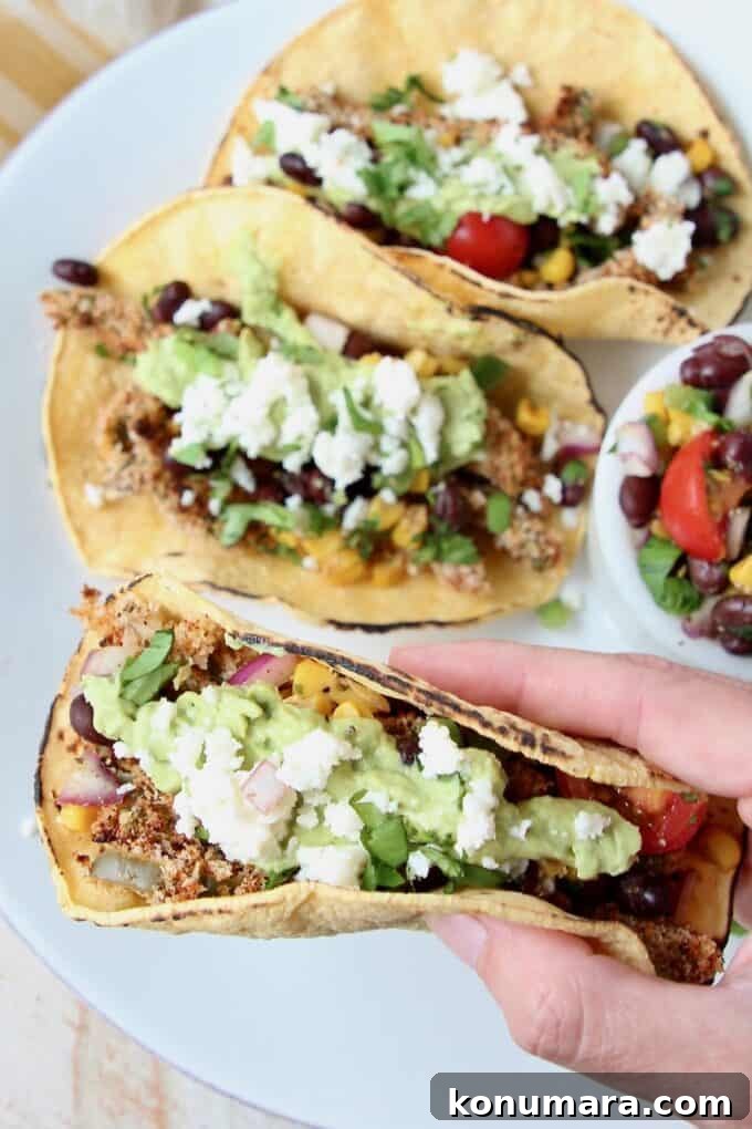 Hand holding taco