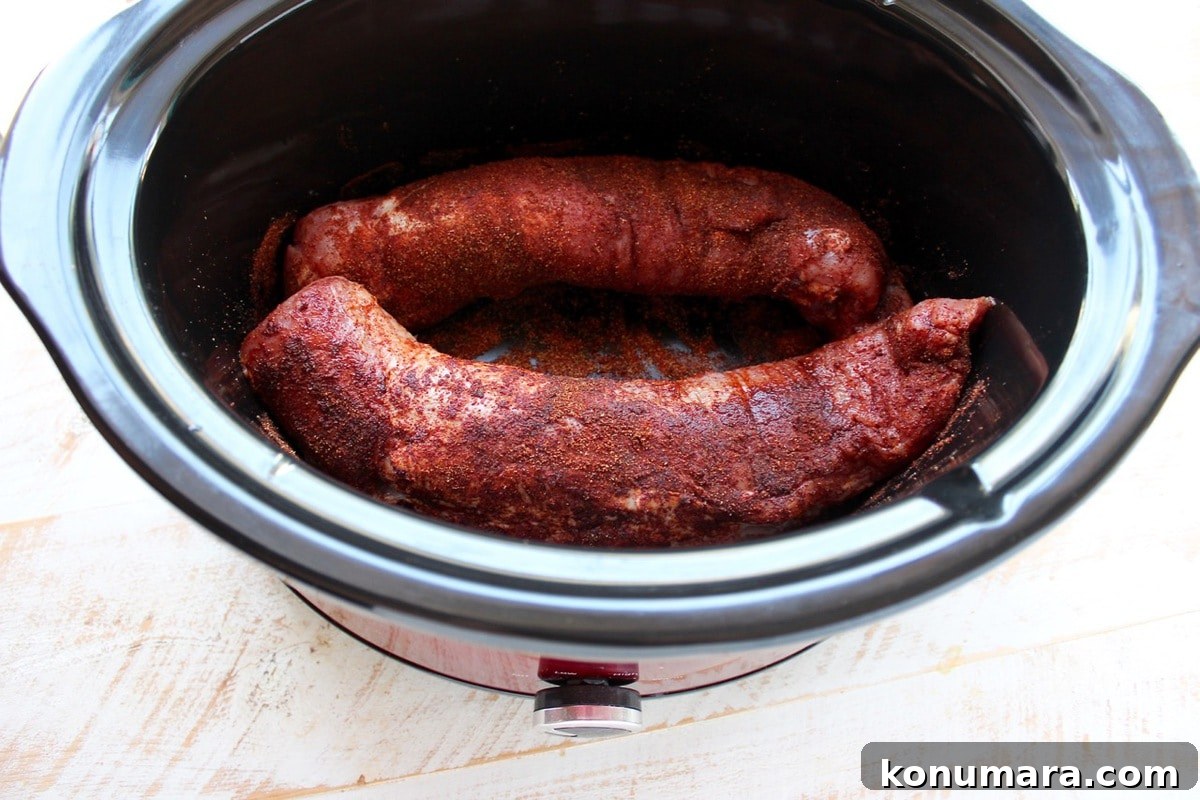 Slow Cooker Chipotle Honey Pulled Pork Tacos Recipe 4 Shredded chipotle honey pulled pork in a slow cooker ready for tacos.