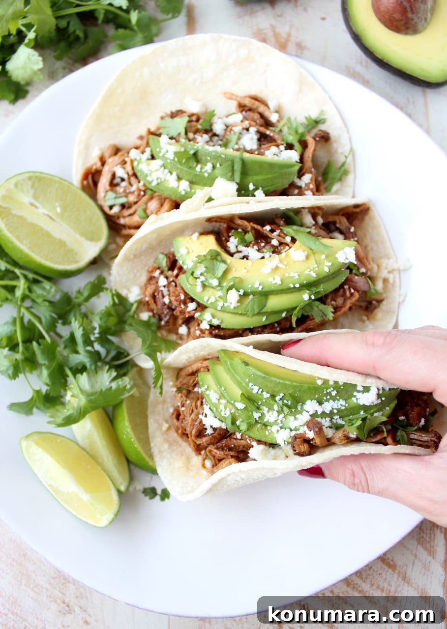 Slow Cooker Chipotle Honey Pulled Pork Tacos Recipe 7 A platter of pulled pork tacos ready to serve.