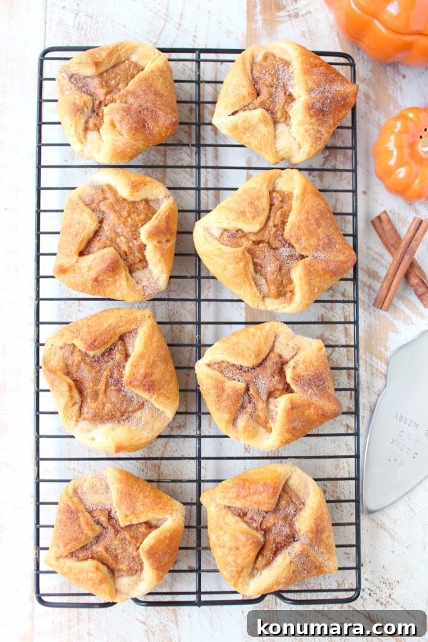 pumpkin filled pastries on wire rack