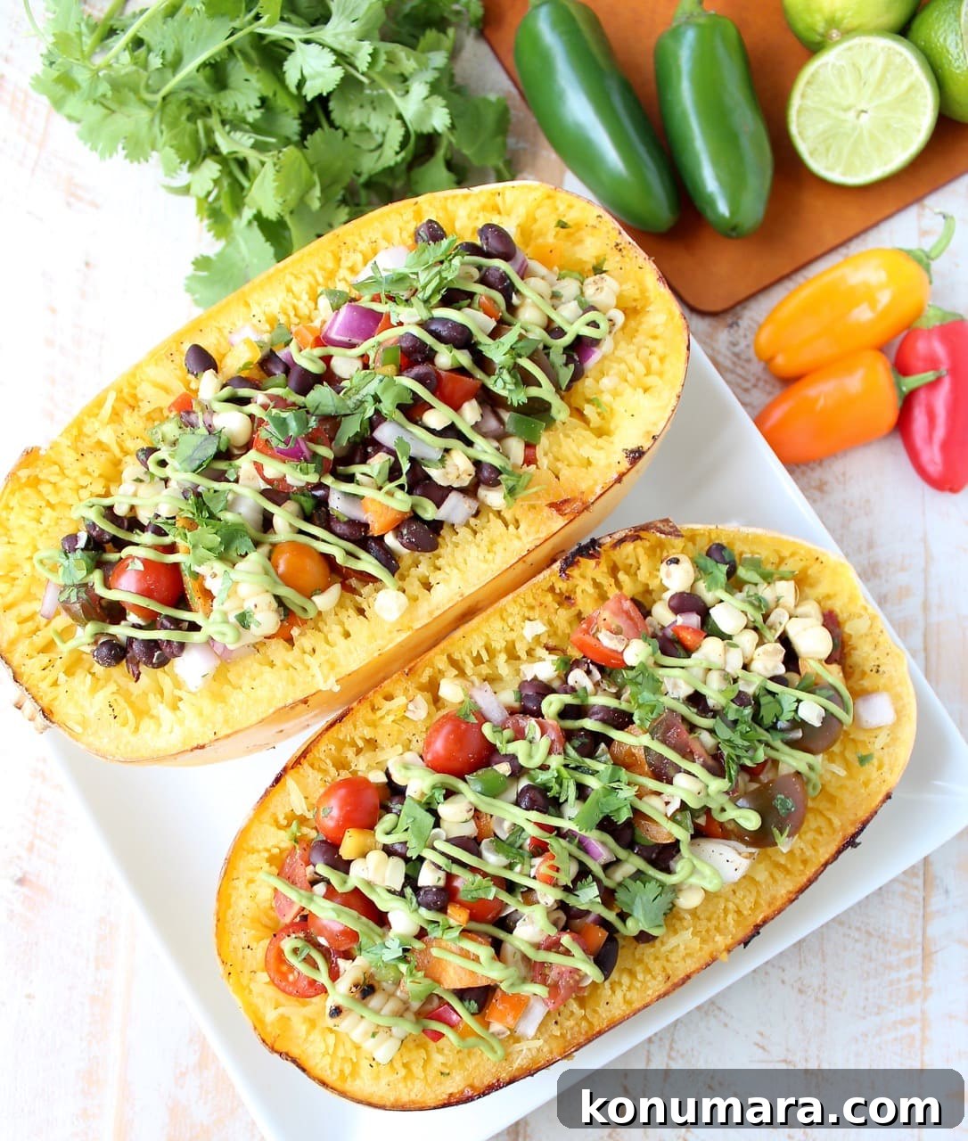 roasted spaghetti squash filled with black bean corn relish on plate