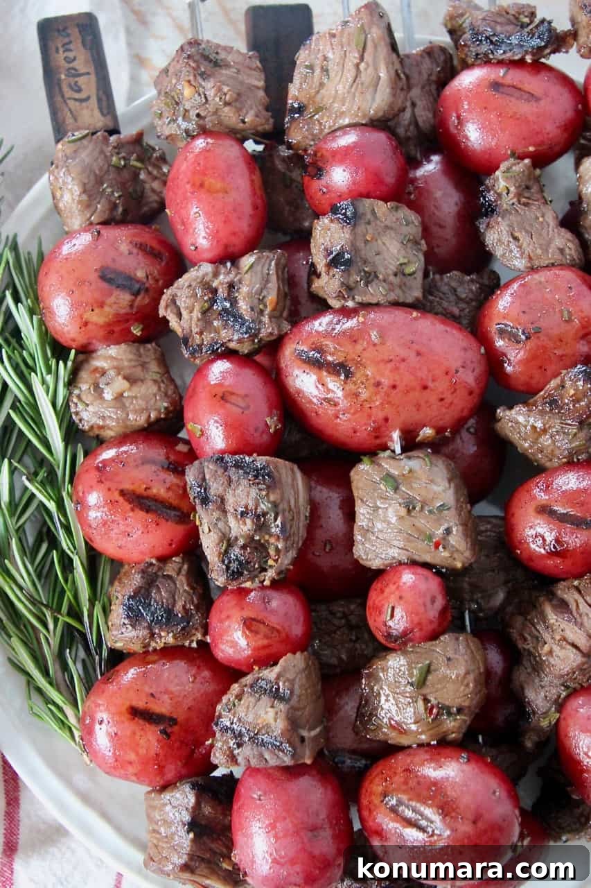Balsamic Herb Marinated Grilled Steak Skewers 6 grilled cubes of sirloin on skewers with red potatoes