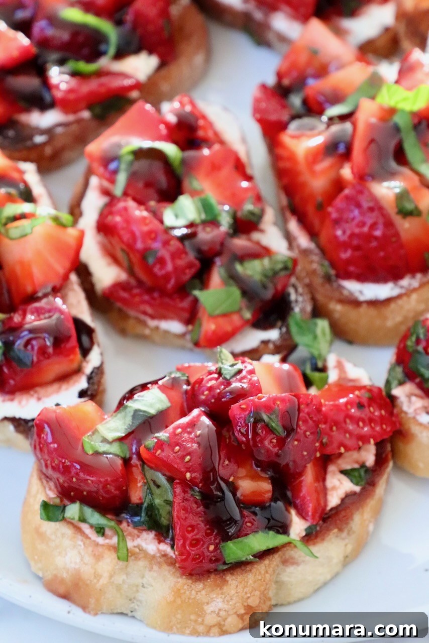 strawberry bruschetta on toasted baguette slices on a plate