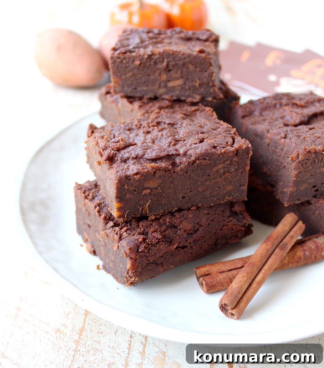 Gluten Free Sweet Potato Brownies are a rich and creamy treat, perfect for fall, topped with vanilla bean ice cream and drizzled with caramel syrup!