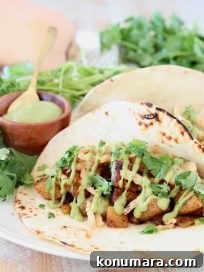 Roasted Butternut Squash Tacos with Avocado and Lime 5 Butternut Squash tacos with creamy avocado sauce and fresh cilantro on flour tortillas