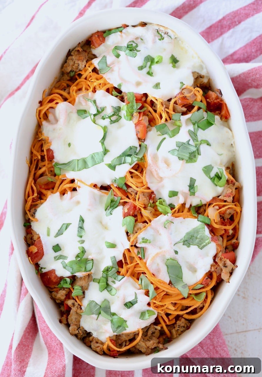 Baked Italian Turkey and Sweet Potato Casserole 3 Italian casserole with sweet potato noodles, topped with mozzarella cheese in an oval baking dish