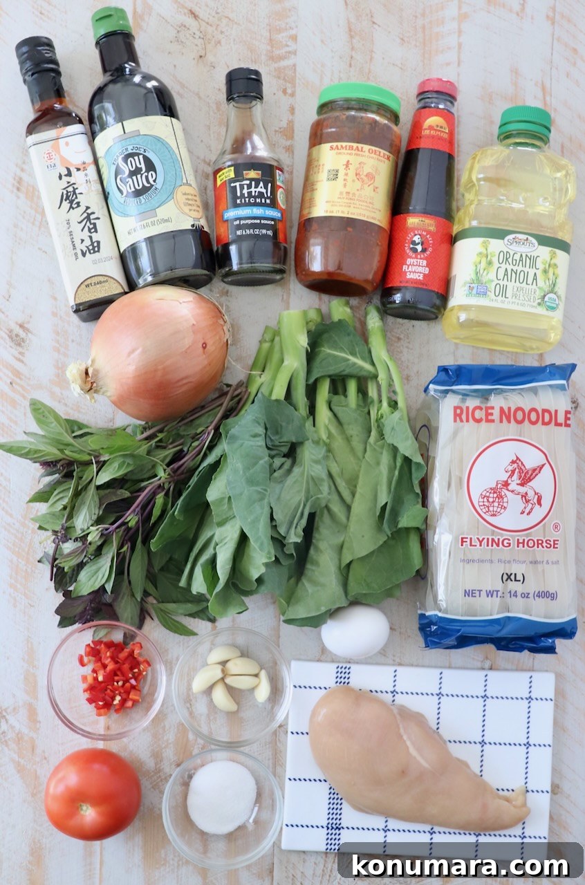 Authentic Thai Drunken Noodles (Pad Kee Mao) Recipe 3 ingredients for drunken noodles on white wood board