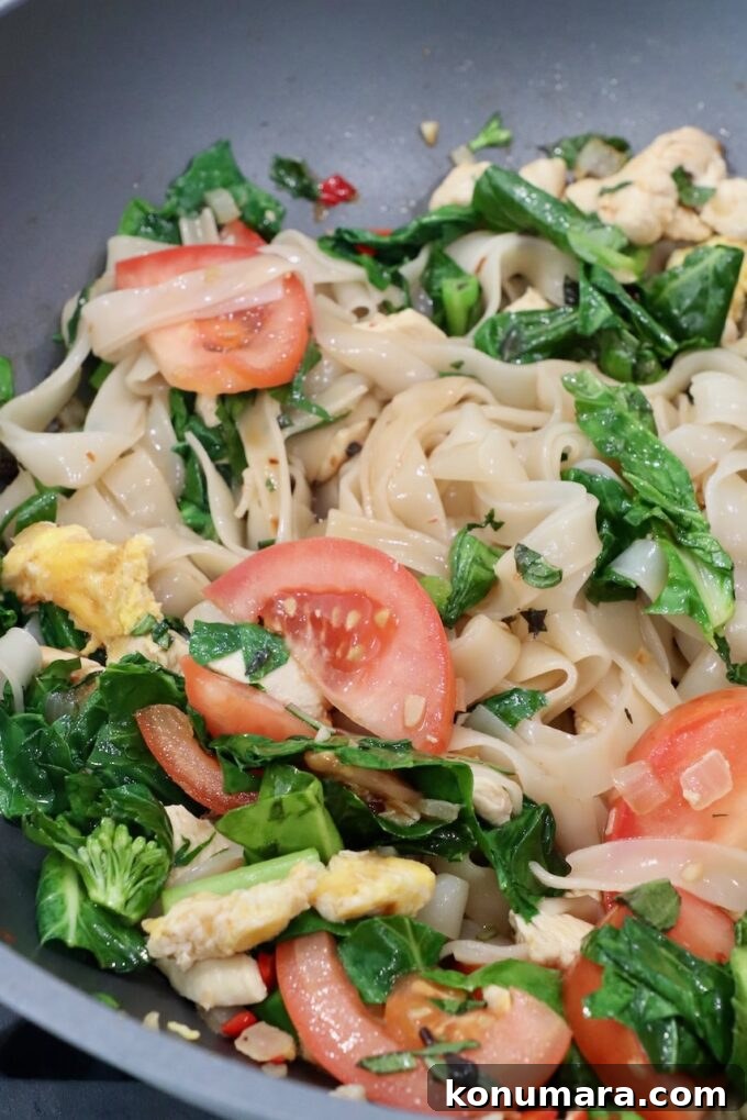 Authentic Thai Drunken Noodles (Pad Kee Mao) Recipe 9 prepared drunken noodles in large wok
