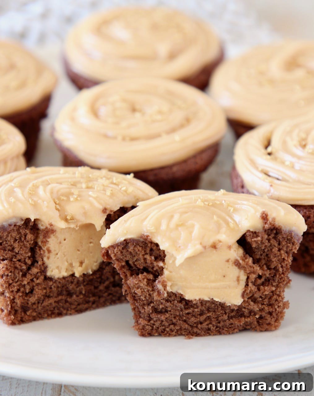 Gluten Free Peanut Butter Chocolate Cupcakes 3 Peanut butter filled chocolate cupcake cut in half on plate
