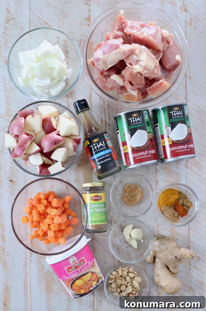 Slow Cooker Massaman Curry Chicken 3 ingredients for massaman curry chicken on white wood board
