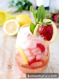 Fresh lemons and strawberries are mixed with bubbly prosecco for a refreshing prosecco sangria recipe that is perfect for spring and summer!