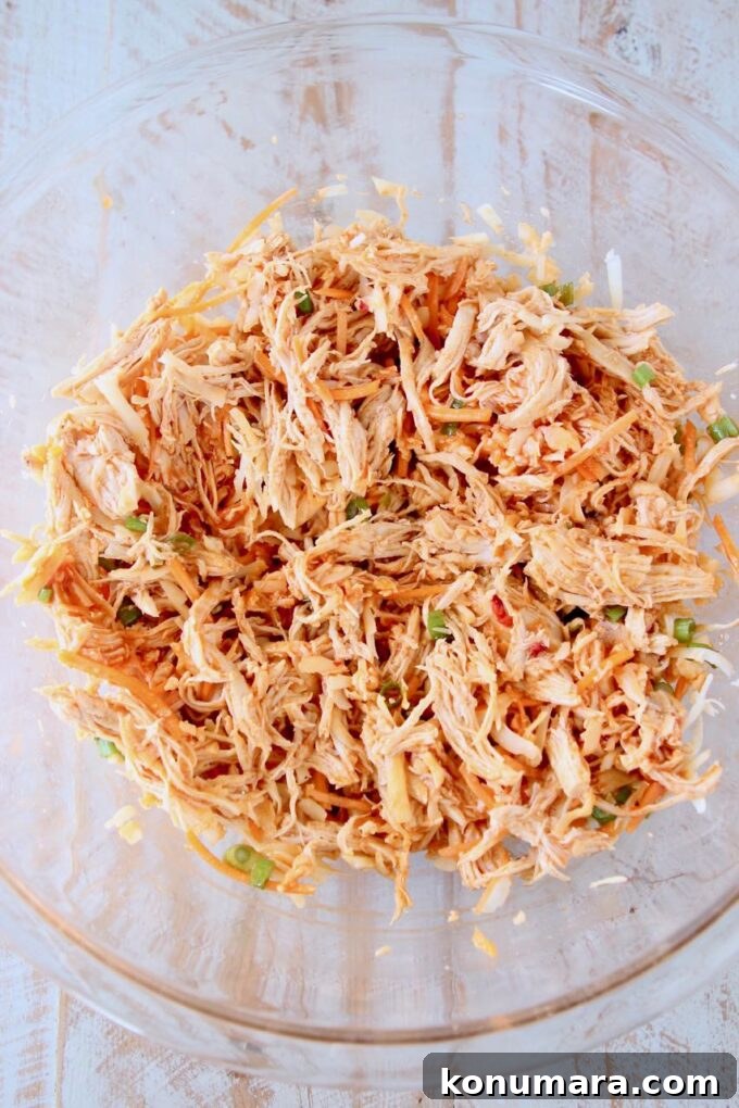 shredded buffalo chicken in glass bowl