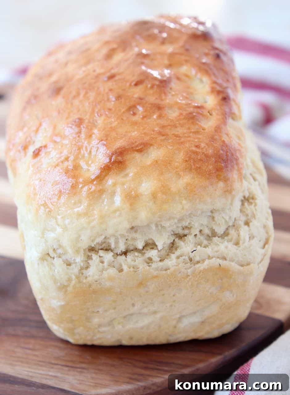 Fluffy Homemade Potato Bread Recipe 3 Loaf of homemade bread on wood cutting board