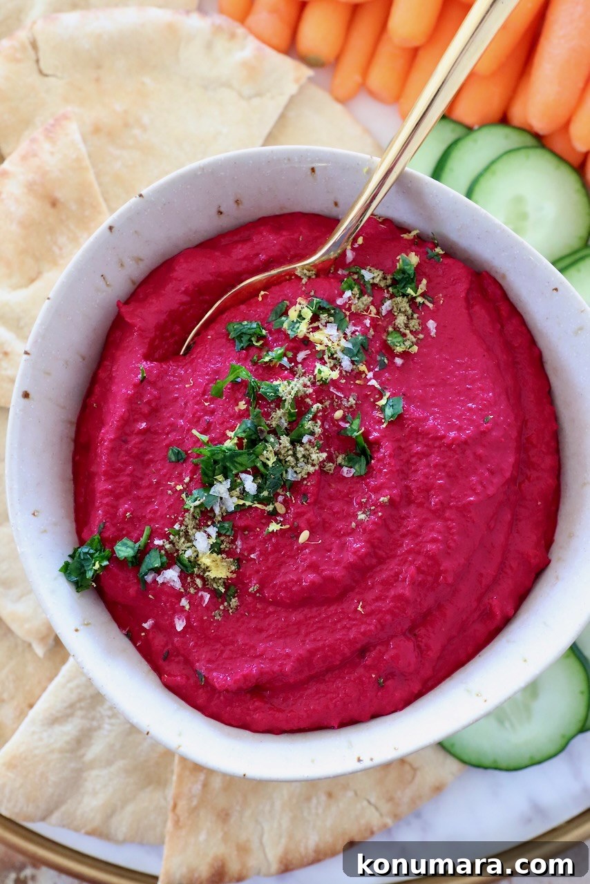Creamy Roasted Beet Hummus with Lemon and Garlic 12 beet hummus in bowl with gold spoon