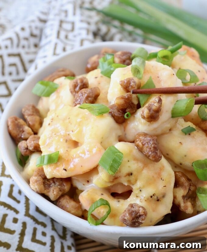 Crispy Honey Walnut Shrimp with Candied Walnuts 2 honey walnut shrimp in bowl with chopsticks