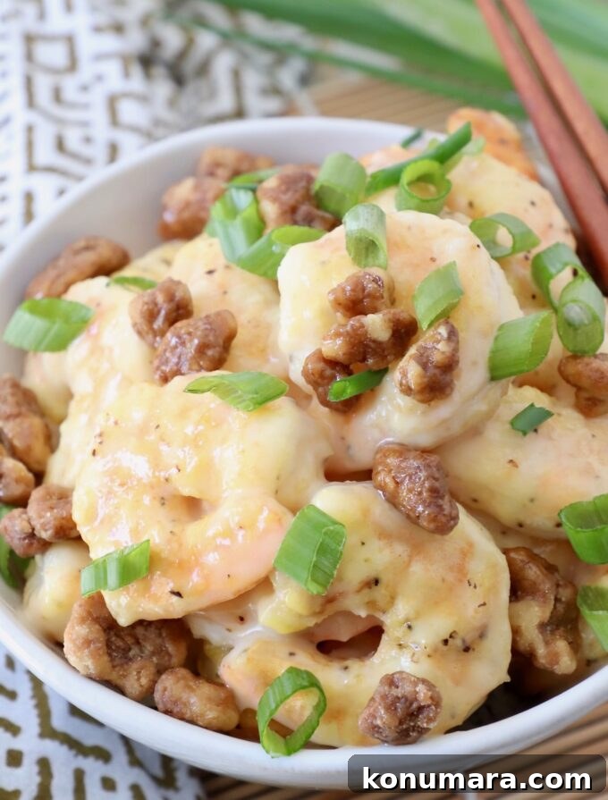 Crispy Honey Walnut Shrimp with Candied Walnuts 10 honey walnut shrimp in bowl topped with diced green onions