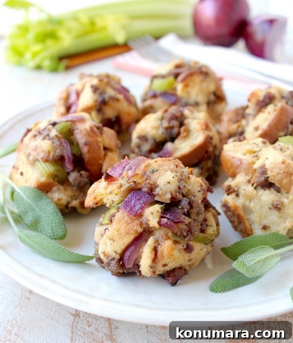 Oven-Baked Sausage Stuffing Balls Recipe 2 sausage balls on plate with fresh sage leaves