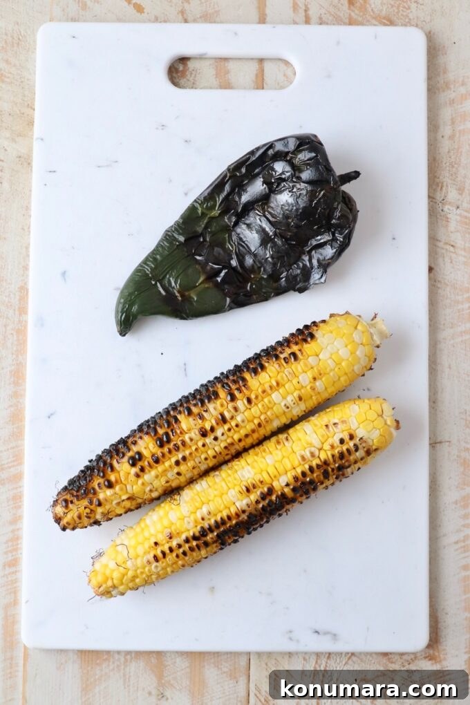 grilled corn and poblano pepper on cutting board