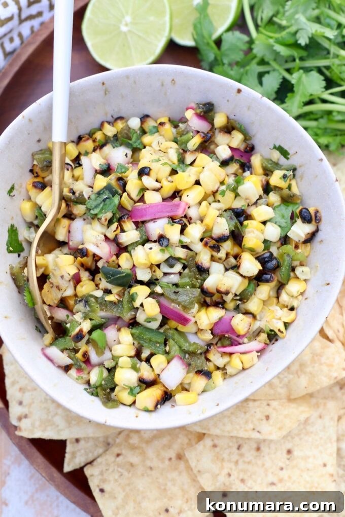 corn and pepper salsa in bowl with spoon