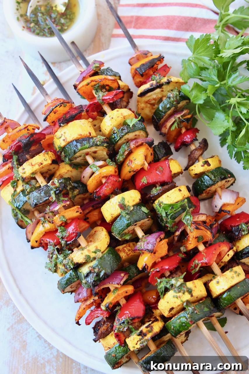 Grilled Vegetable Skewers Recipe with Garlic Herb Marinade 2 grilled vegetables on skewers on white plate