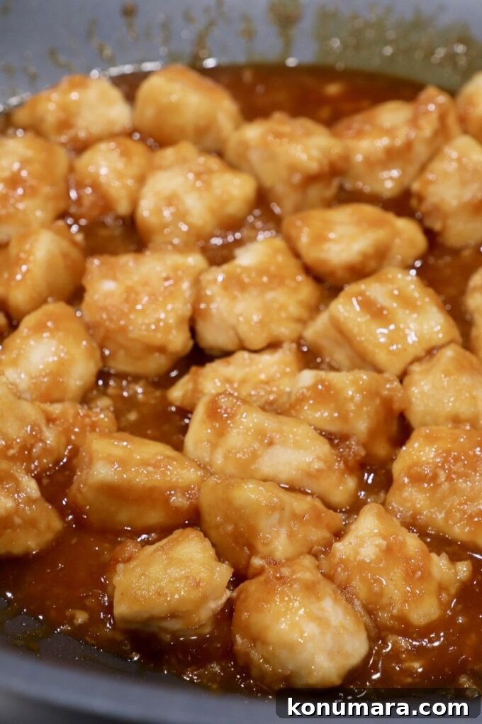 cooked orange chicken in skillet