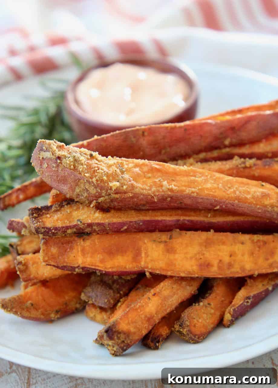 Sweet potato fries stacked up on plate