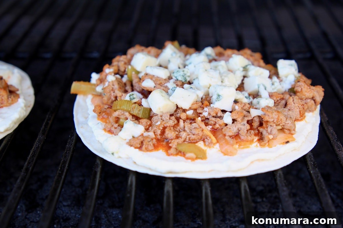 Buffalo Turkey Grilled Flatbread with Melted Cheese 4 Buffalo turkey flatbread on a grill
