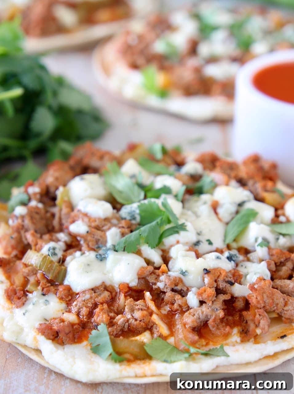Buffalo Turkey Grilled Flatbread with Melted Cheese 5 Cheesy buffalo turkey flatbread topped with fresh cilantro