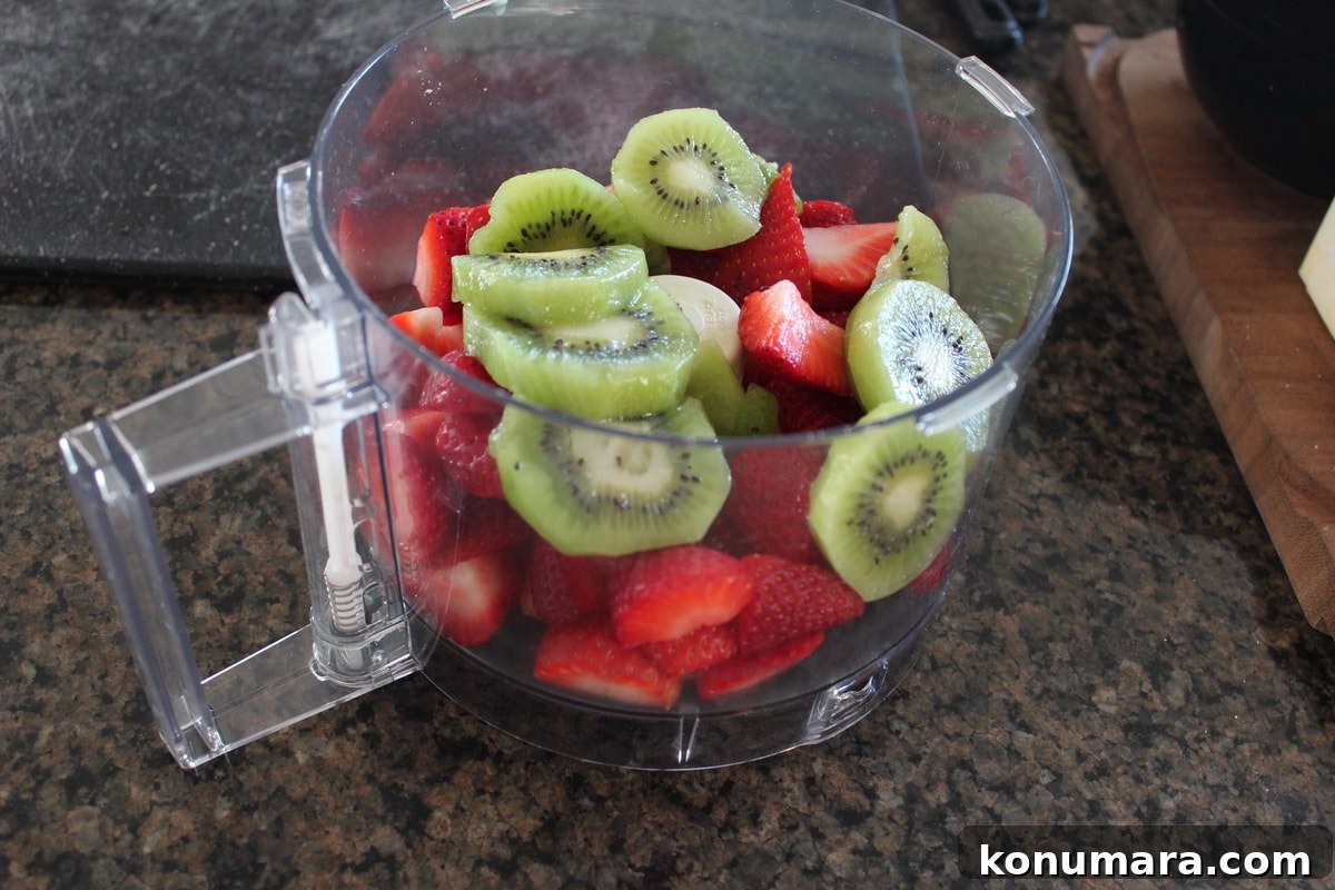 Fresh strawberries and kiwi in a Food Processor