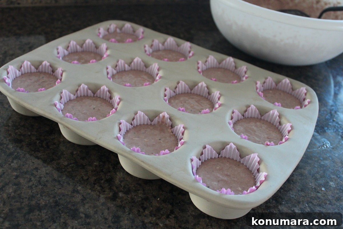 unbaked Strawberry Kiwi Cupcakes in a muffin pan