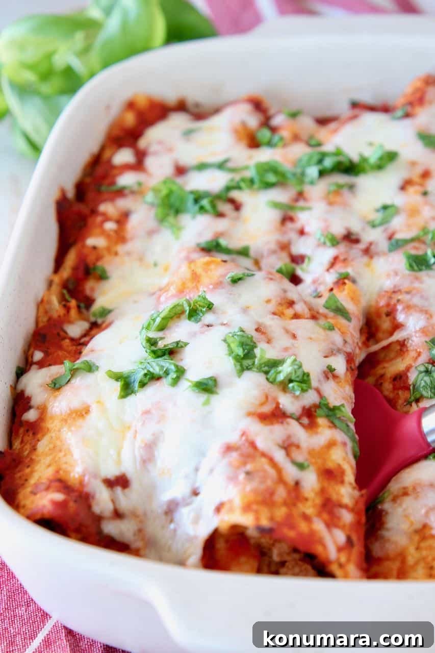 Italian Style Enchiladas with Tomato Basil Sauce 2 Enchiladas in casserole dish