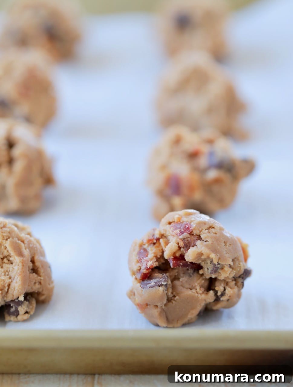 Nutella Bacon Chocolate Chip Cookies Recipe 4 Bacon chocolate chip cookie dough balls on baking sheet lined with parchment paper
