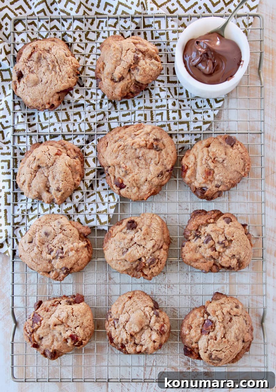Nutella Bacon Chocolate Chip Cookies Recipe 5 Bacon chocolate chip cookies on wire rack with towel underneath and bowl of nutella