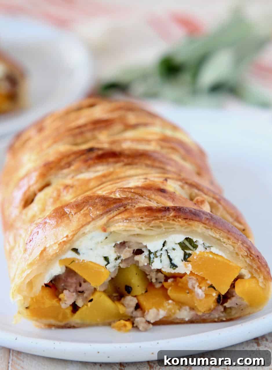 Strudel cut open, filled with butternut squash, sausage and ricotta cheese