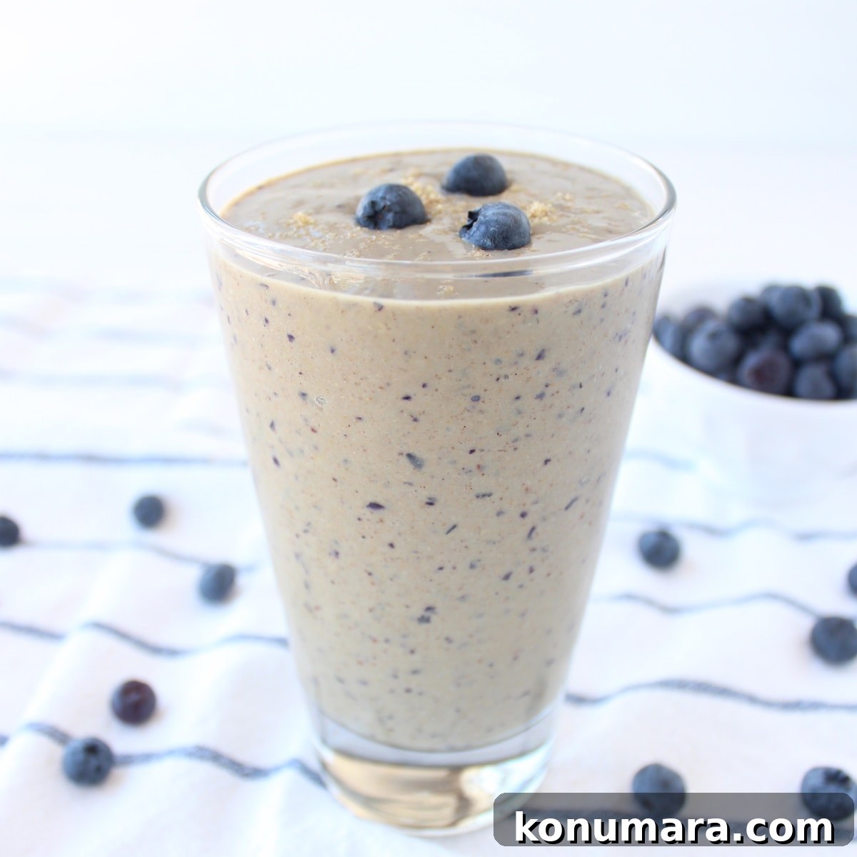 Pouring smoothie into a glass