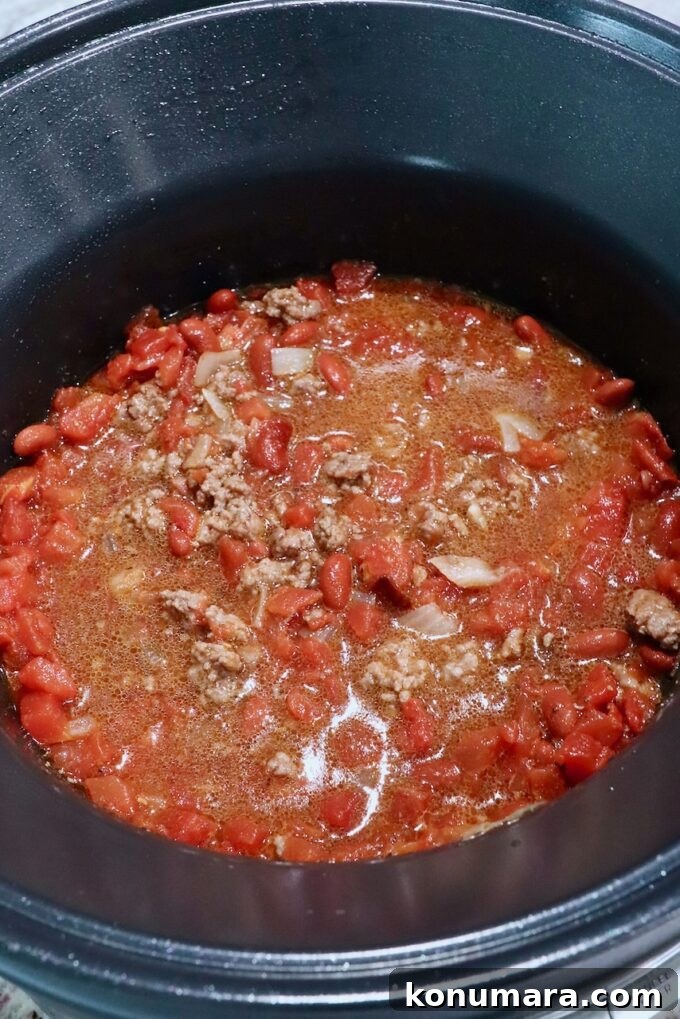 ingredients for chili mixed together in a pot