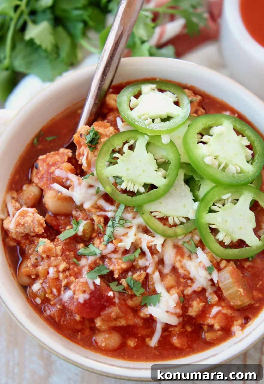 Slow Cooker Buffalo Chicken Chili Recipe 2 Buffalo chicken chili in bowl topped with fresh sliced jalapenos
