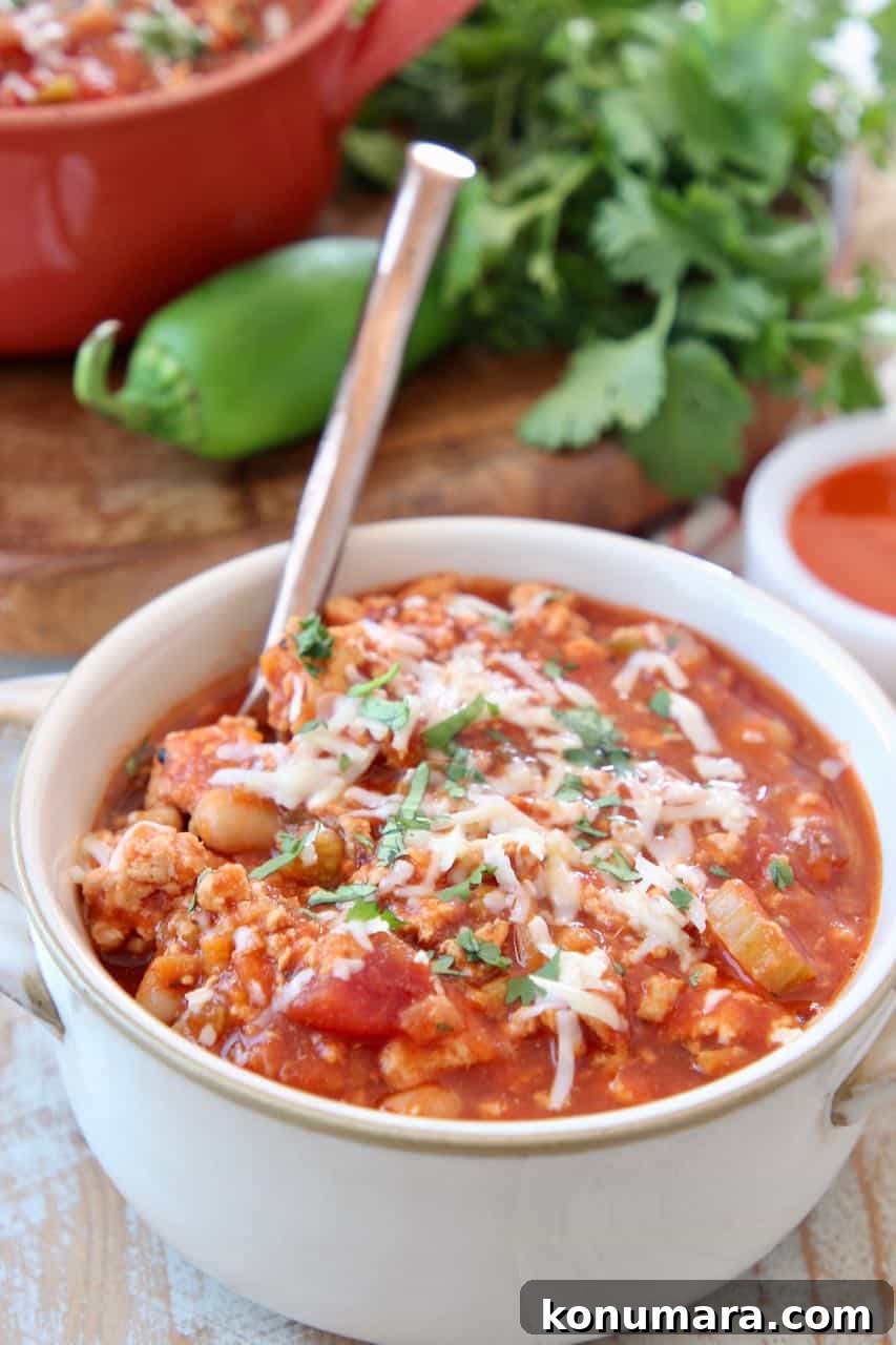 Slow Cooker Buffalo Chicken Chili Recipe 4 Chili in white bowl with spoon
