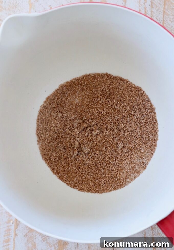 sugar and pumpkin pie spice in mixing bowl
