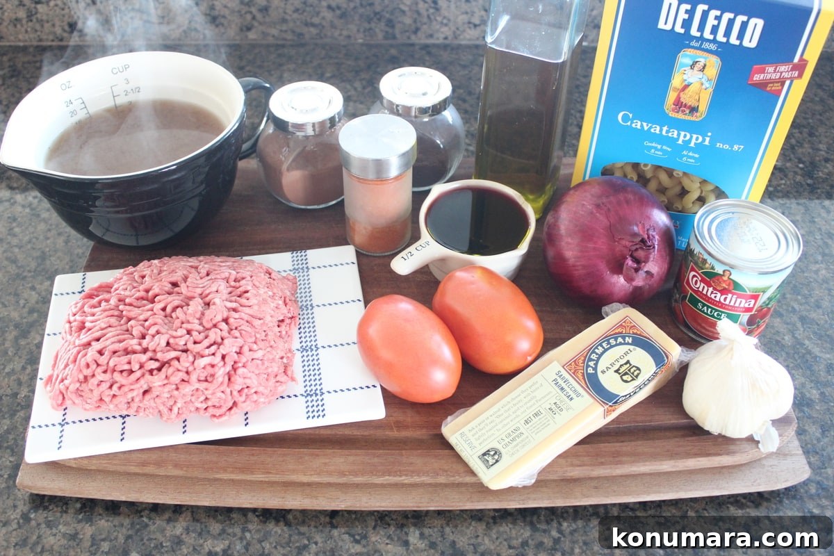 One-Pot Beef and Macaroni Recipe 3 Mediterranean Spiced Beef and Macaroni Ingredients on a wood board