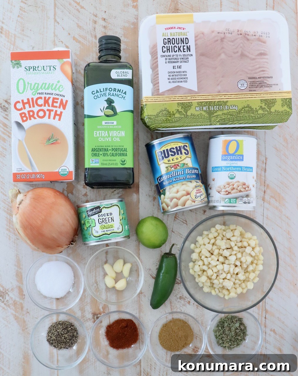 ingredients for white chicken chili on white wood board