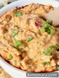 cheeseburger dip in bowl with spoon