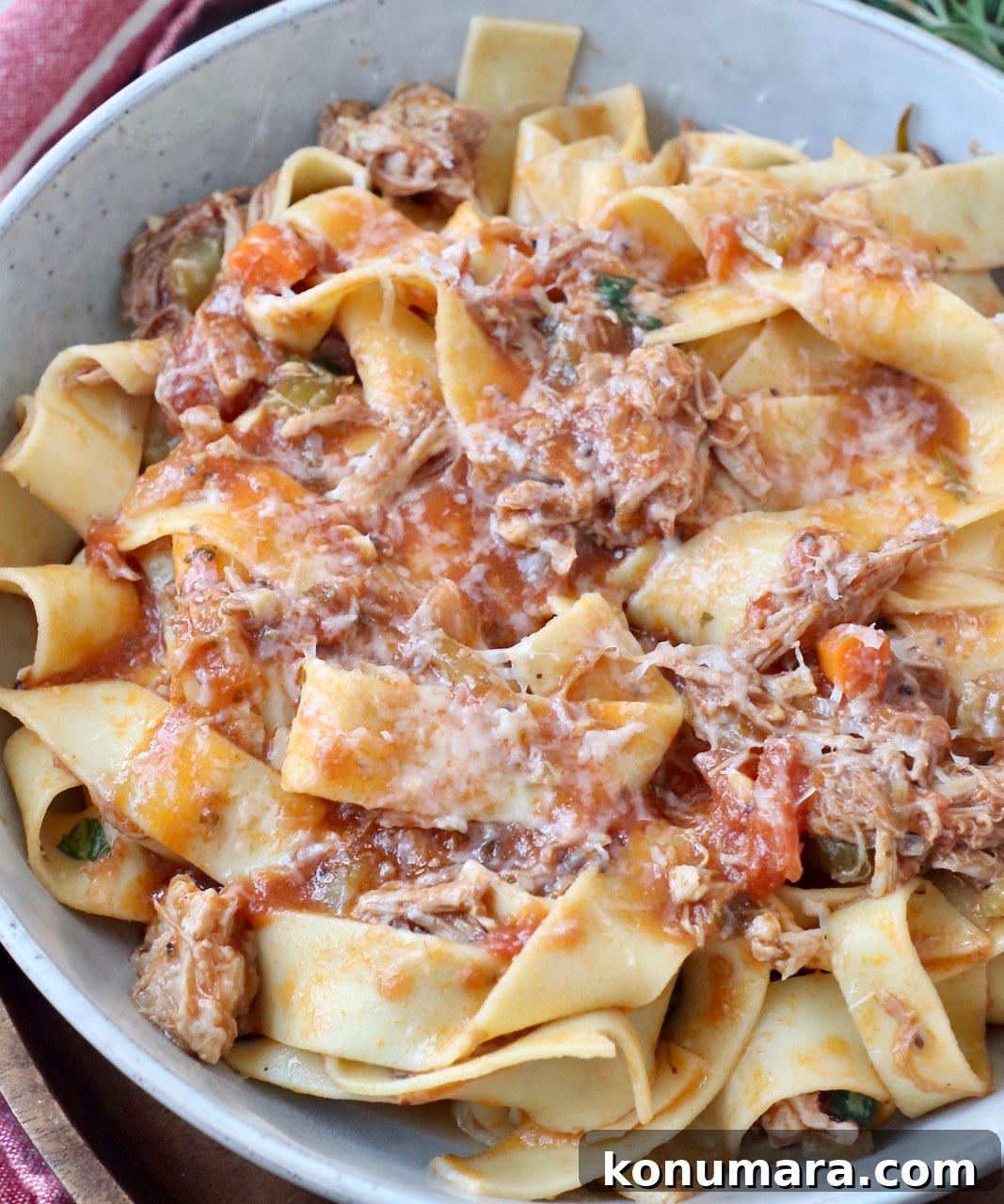 Authentic Slow Simmered Pork Ragu Recipe 11 cooked pasta tossed with pork ragu sauce in a bowl