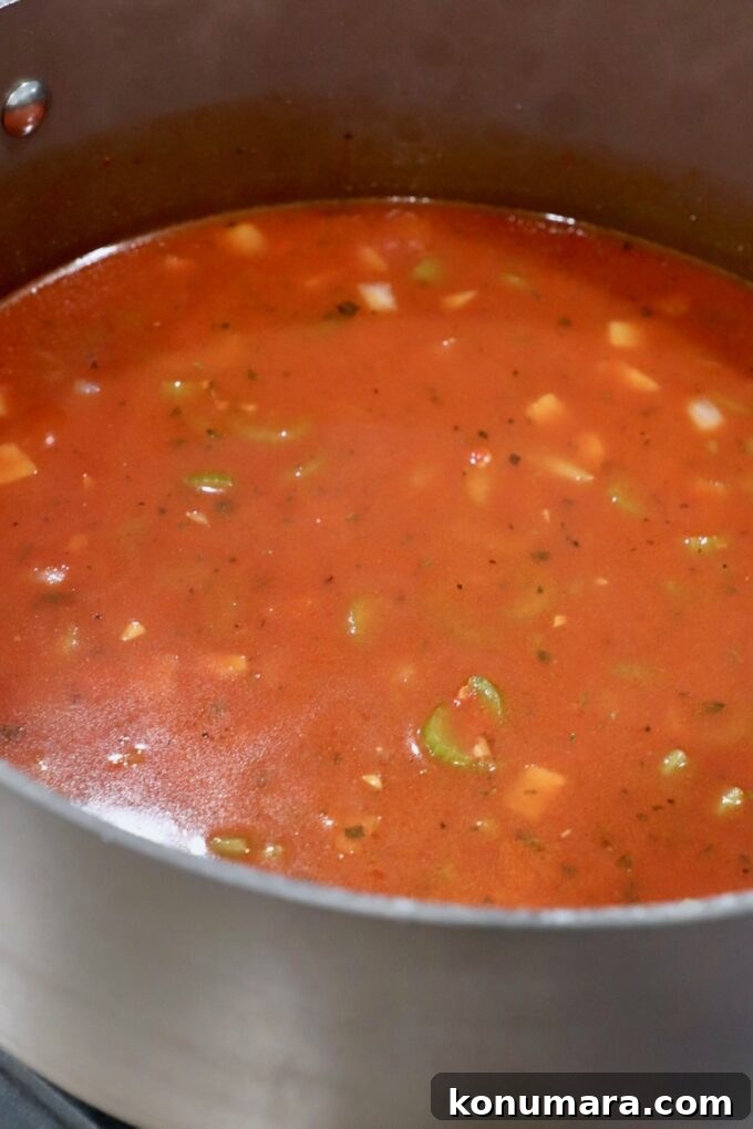 Authentic Slow Simmered Pork Ragu Recipe 7 tomato sauce and vegetables in pot