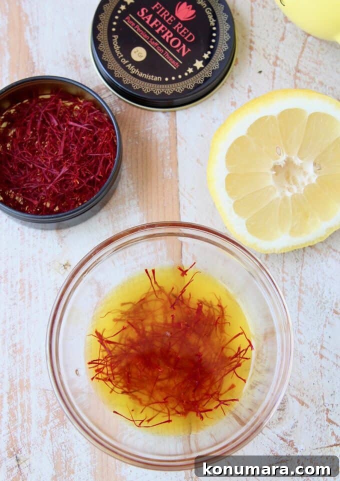 Authentic Spanish Chorizo and Chicken Paella Recipe 4 saffron threads soaking in lemon juice in bowl