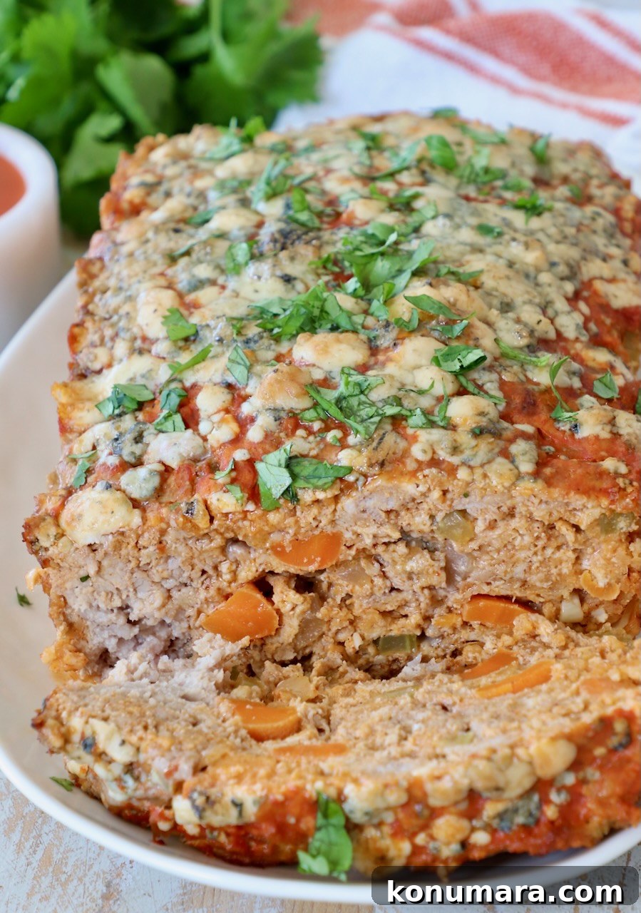 Spicy Buffalo Chicken Meatloaf with Blue Cheese 2 buffalo chicken meatloaf sliced on plate
