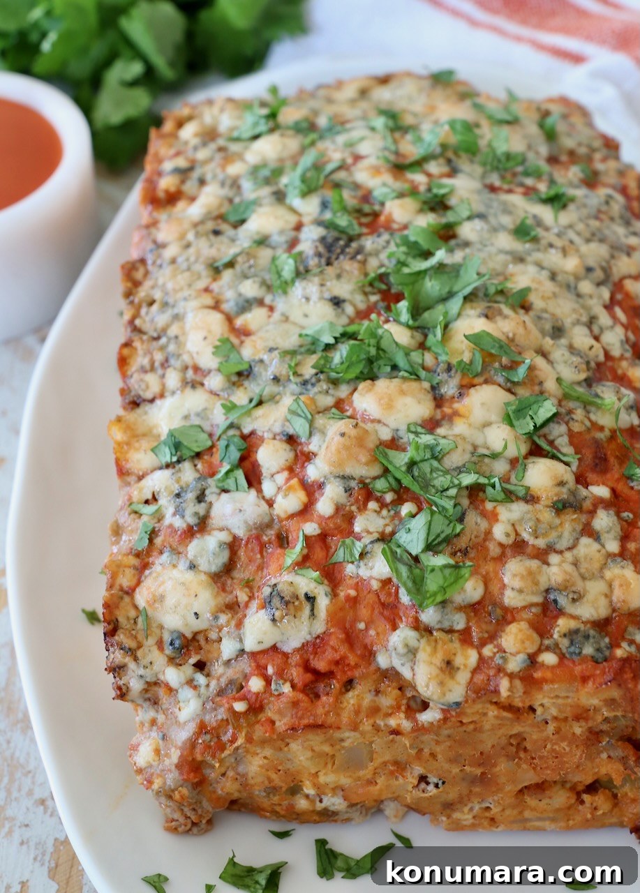 Spicy Buffalo Chicken Meatloaf with Blue Cheese 8 cooked buffalo chicken meatloaf on plate